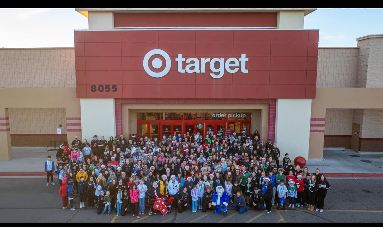 Hundreds of Peoria Police officers, AE Outdoor Living volunteers, and local families gathered outside Target for the annual Shop With a Cop event