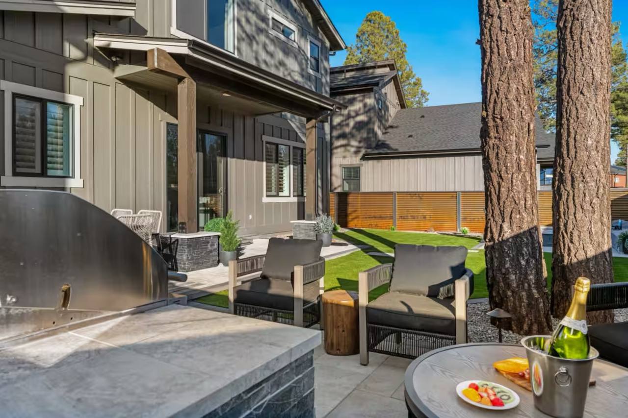 Full Arizona backyard transformation — pool, paver patio, turf, and shade structure by AE Outdoor Living