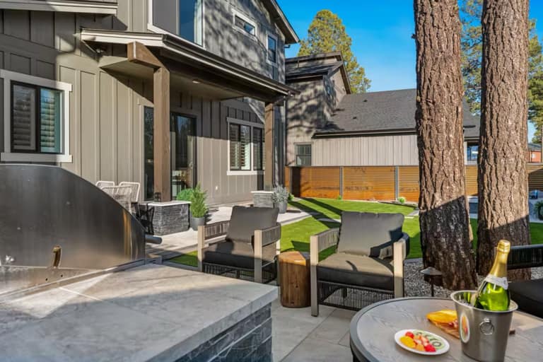 Full Arizona backyard transformation — pool, paver patio, turf, and shade structure by AE Outdoor Living