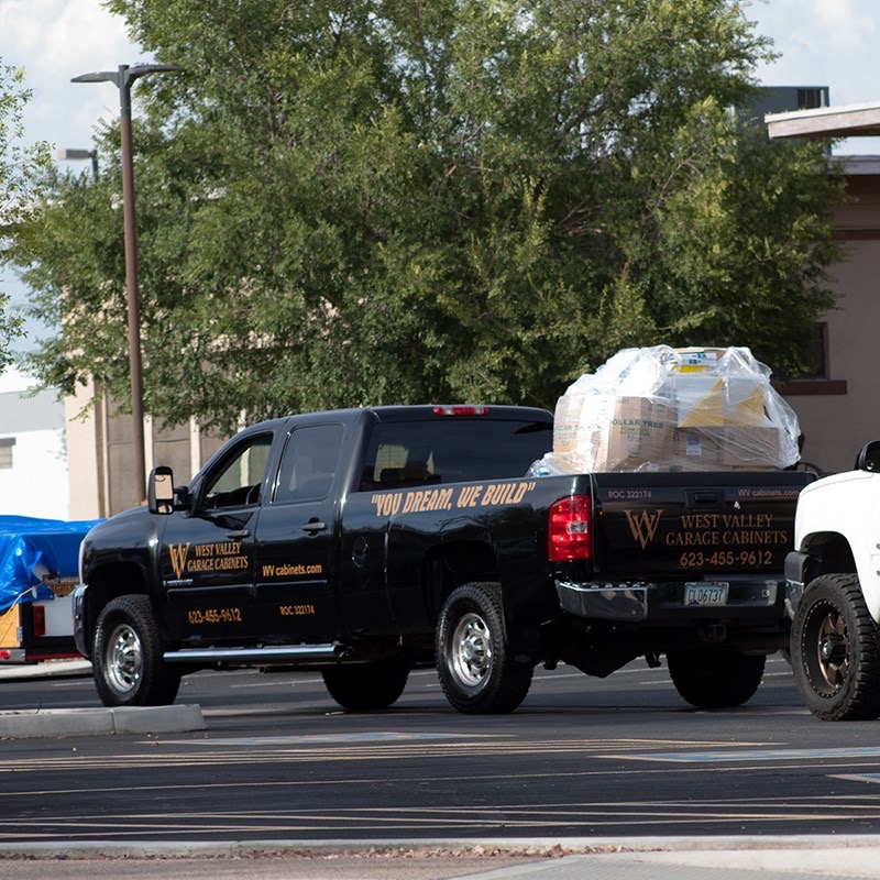 West Valley Garage Cabinets pickup truck loaded with a shrink-wrapped pallet of donated supplies