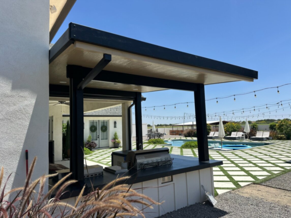 Full Arizona backyard transformation — pool, paver patio, turf, and shade structure by AE Outdoor Living