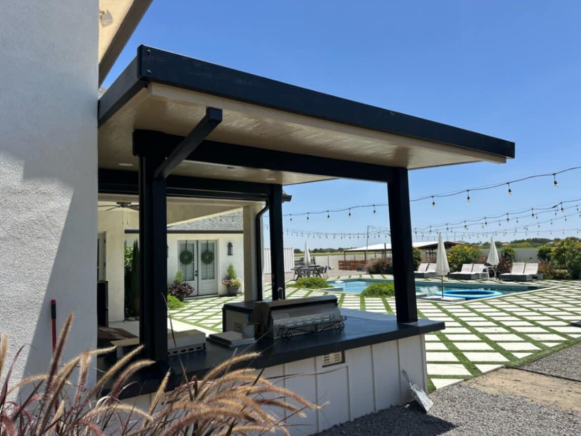 Full Arizona backyard transformation — pool, paver patio, turf, and shade structure by AE Outdoor Living
