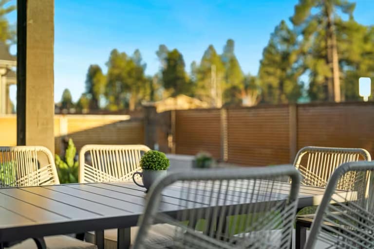 Full Arizona backyard transformation — pool, paver patio, turf, and shade structure by AE Outdoor Living