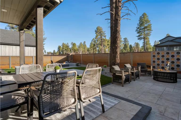 Travertine paver patio installation on engineered base for an Arizona backyard