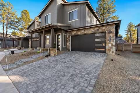 Full Arizona backyard transformation — pool, paver patio, turf, and shade structure by AE Outdoor Living