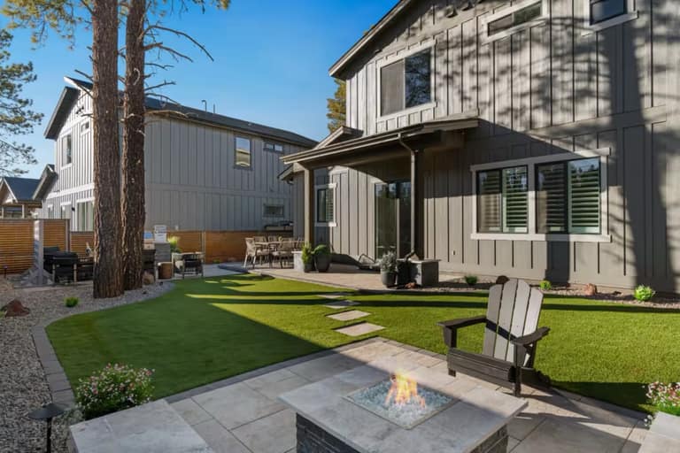 Full Arizona backyard transformation — pool, paver patio, turf, and shade structure by AE Outdoor Living