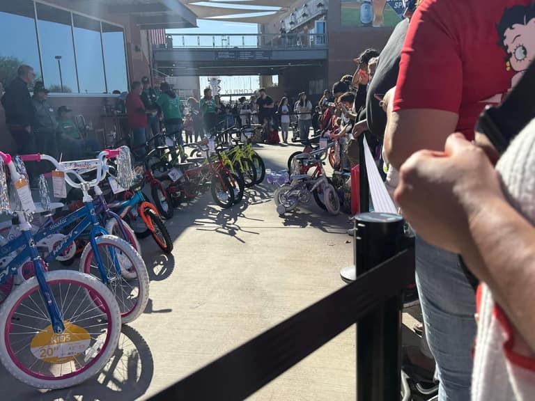 Rows of new kids' bikes given away at A Day of Giving 2025 at Peoria Sports Complex