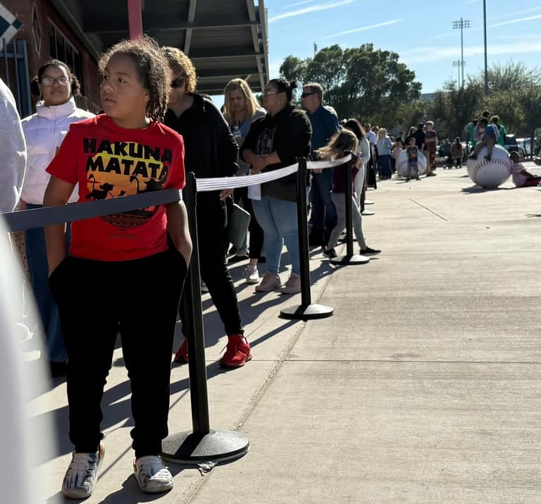 Families lined up along Peoria Sports Complex concourse for A Day of Giving 2025