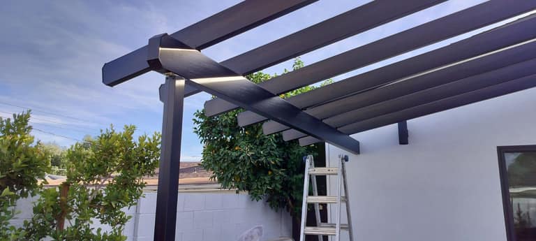 Welded steel pergola detail — hidden fasteners, painted finish, built for AZ sun.