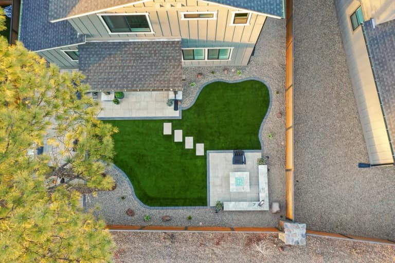 Full Arizona backyard transformation — pool, paver patio, turf, and shade structure by AE Outdoor Living