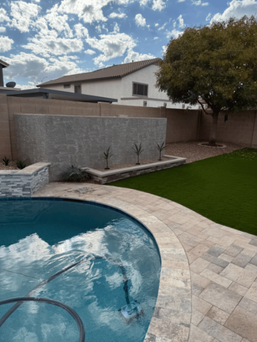 Thorn residence Mesa AZ pool, travertine paver deck, water-feature wall, and turf lawn