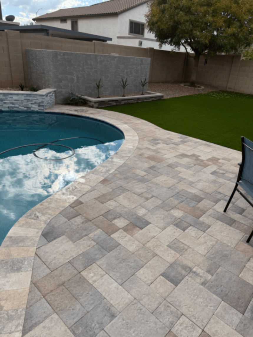 Thorn residence Mesa AZ travertine paver pool deck with curved bullnose coping and turf edge