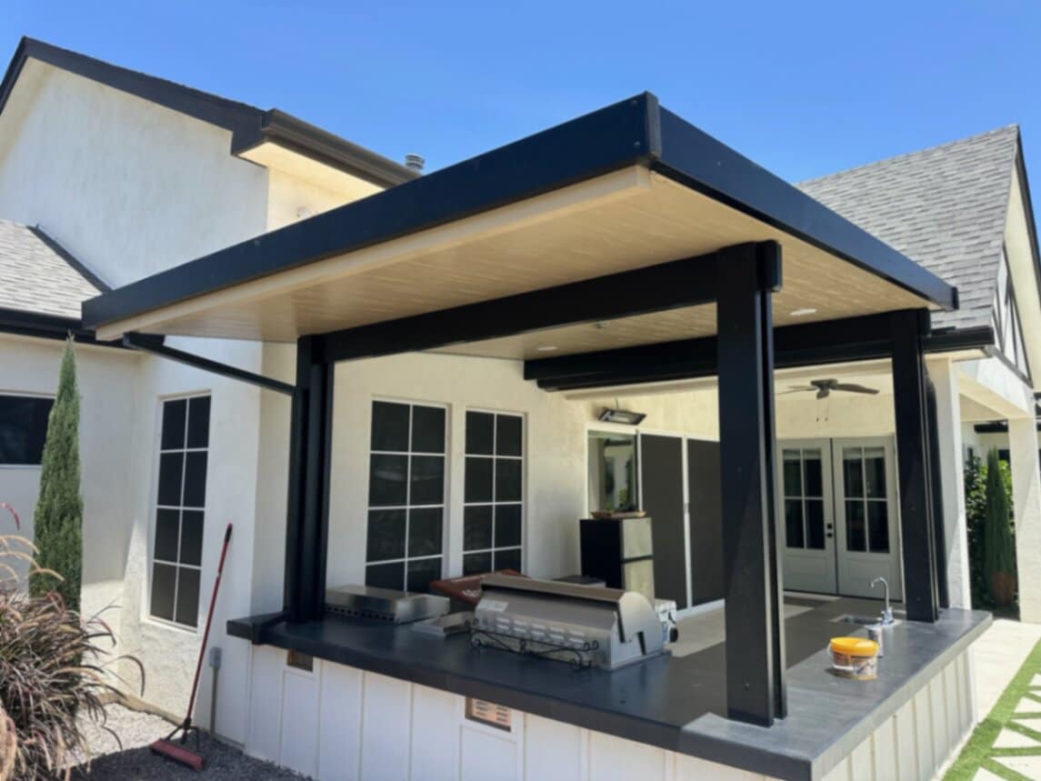 Engineered pergola shading an Arizona patio with built-in seating and lighting