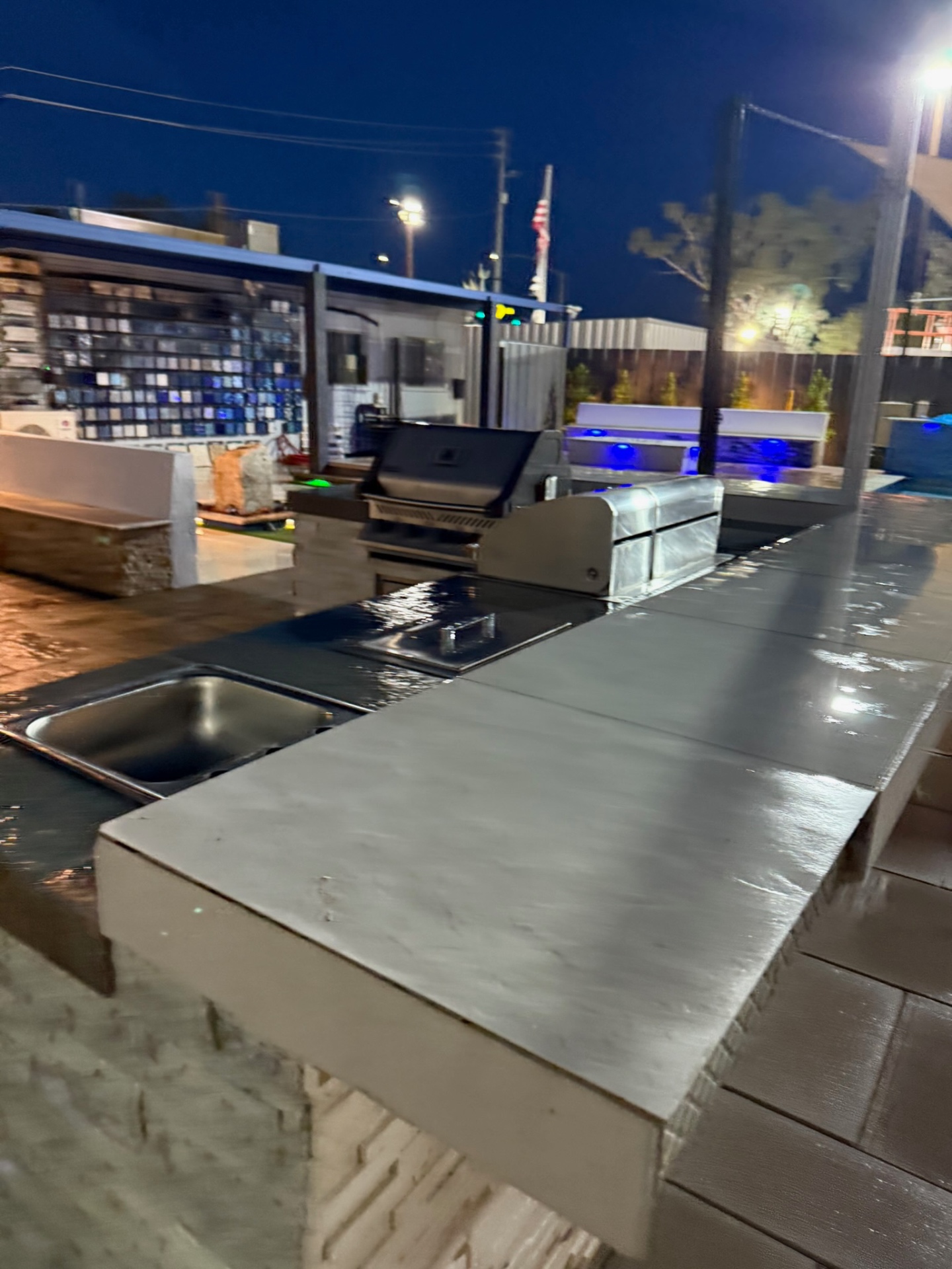 Outdoor kitchen island with built-in grill and side burner