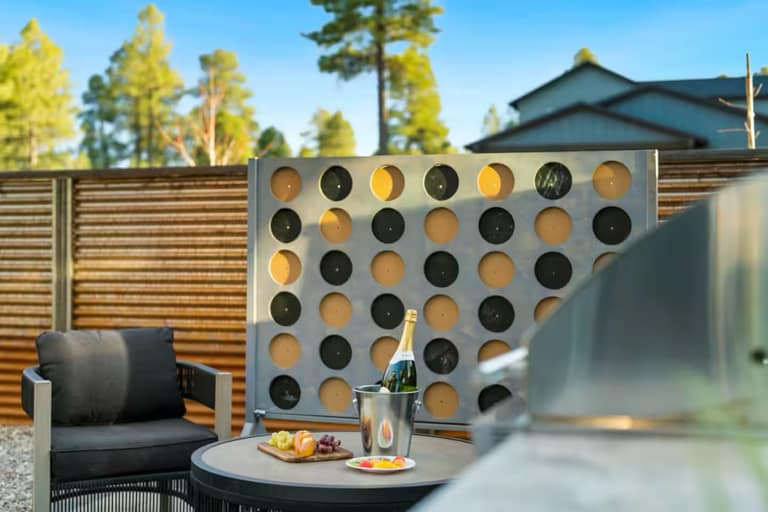 Full Arizona backyard transformation — pool, paver patio, turf, and shade structure by AE Outdoor Living