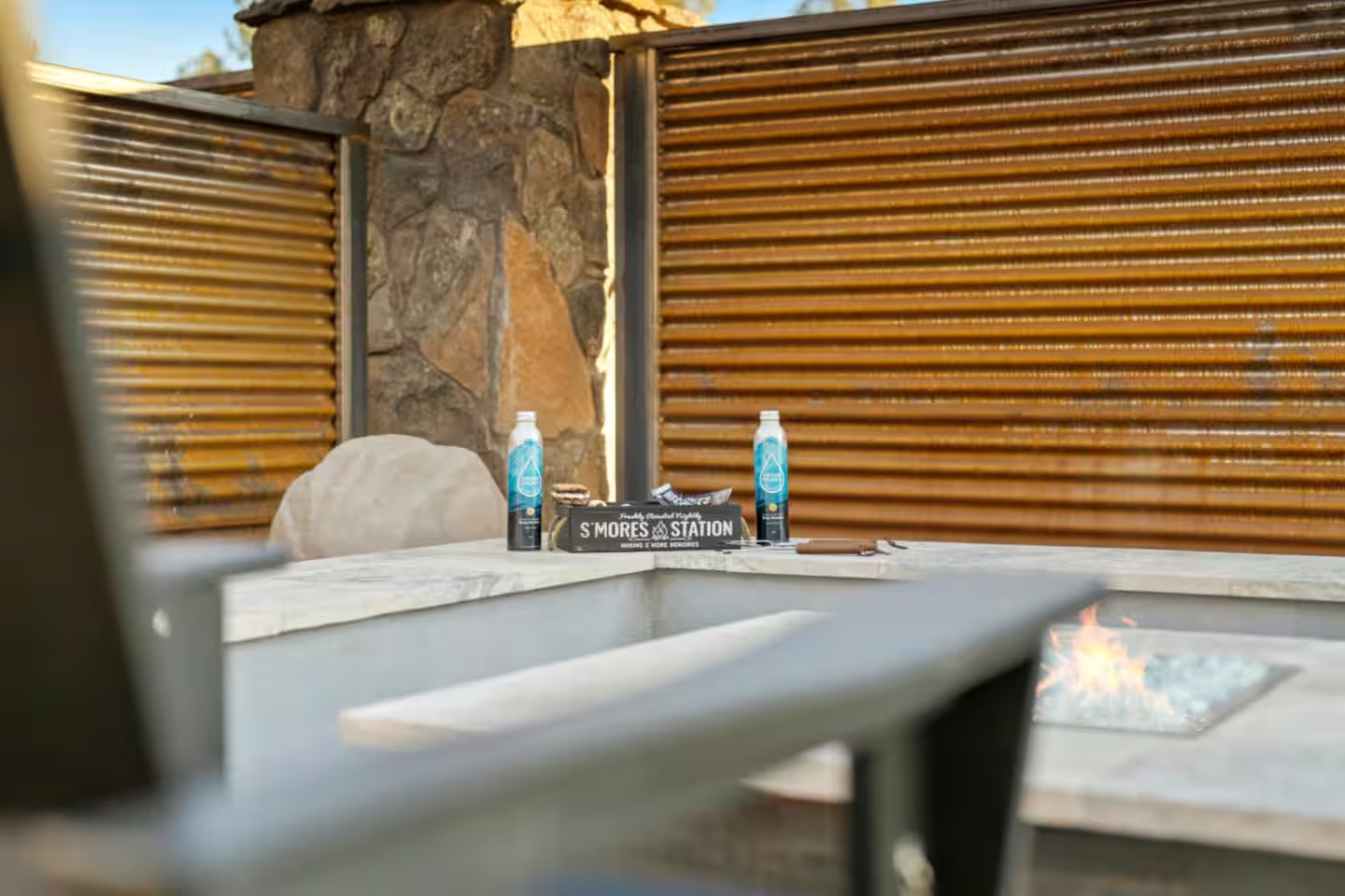 Custom fire feature with stone surround integrated into an Arizona outdoor living space