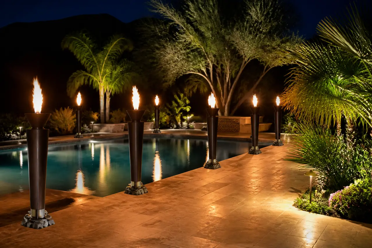 Gas Tiki Torch Perimeter — Permanent gas-line tiki torches around pool or patio. by AE Outdoor Living