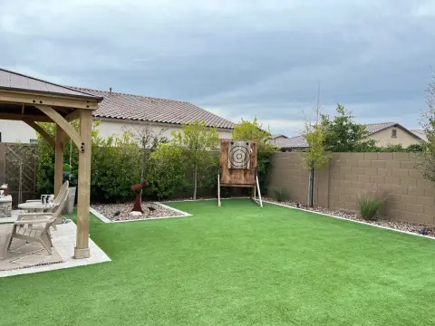 Axe-throwing lane with synthetic turf base and clean edging
