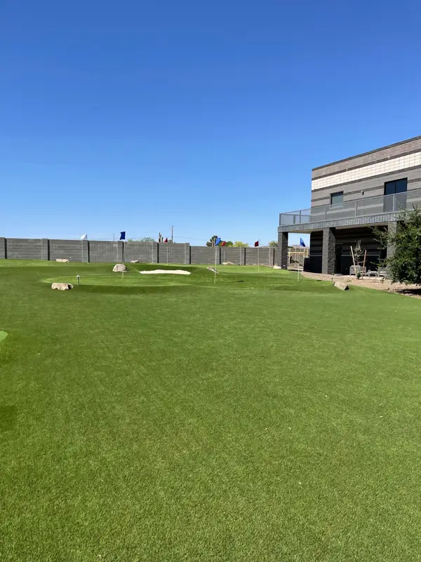 Putting green installation with fringe turf and cup placement